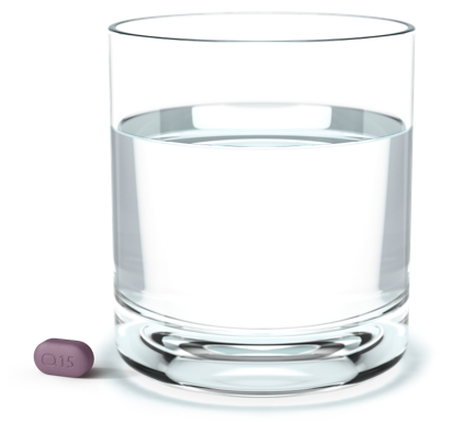 Rinvoq pill next to a glass of water