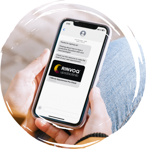 A person holding a phone showing the Rinvoq 2-minute appointment pre check link via text message