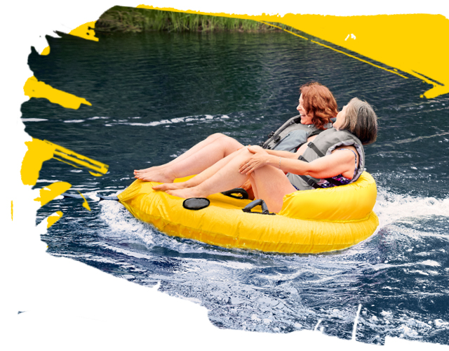 Women river tubing Women tubing on the river while having Rheumatoid Arthritis