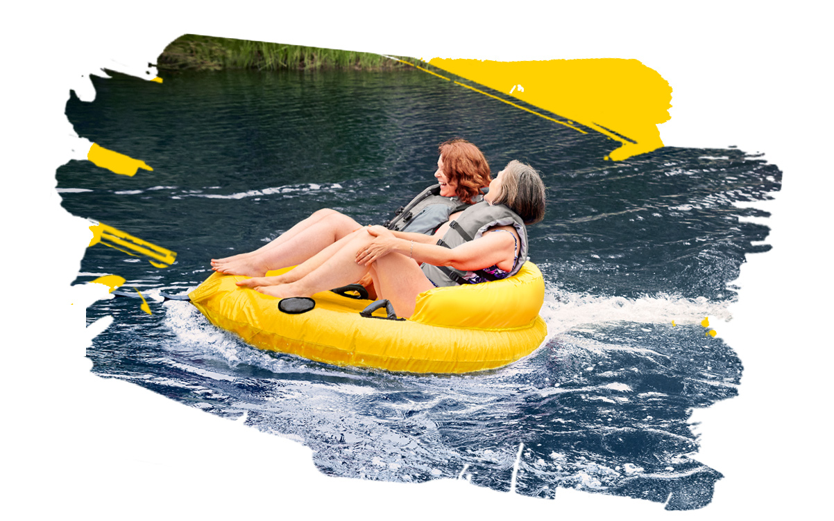 Women river tubing Women tubing on the river while having Rheumatoid Arthritis