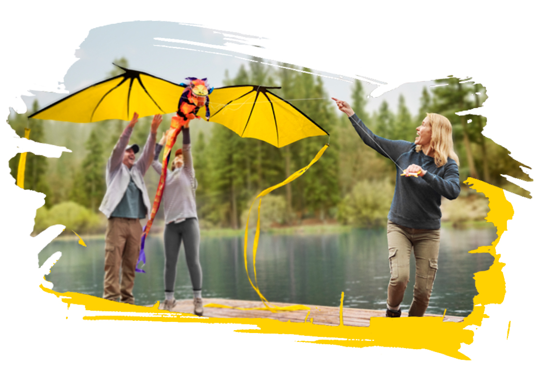 Woman flying kite with friends while having Rheumatoid Arthritis