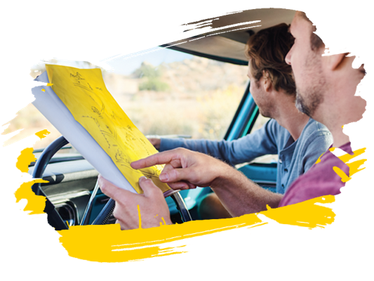 Person reading a road map during a road trip Person reading a road map during a road trip