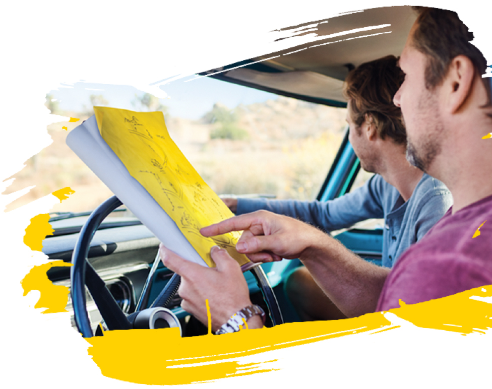Person reading a road map during a road trip Person reading a road map during a road trip