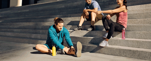 Man stretching on the ground.