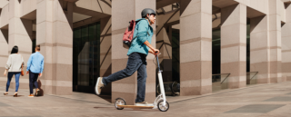 Man riding a scooter.