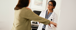 Woman talking with her doctor.